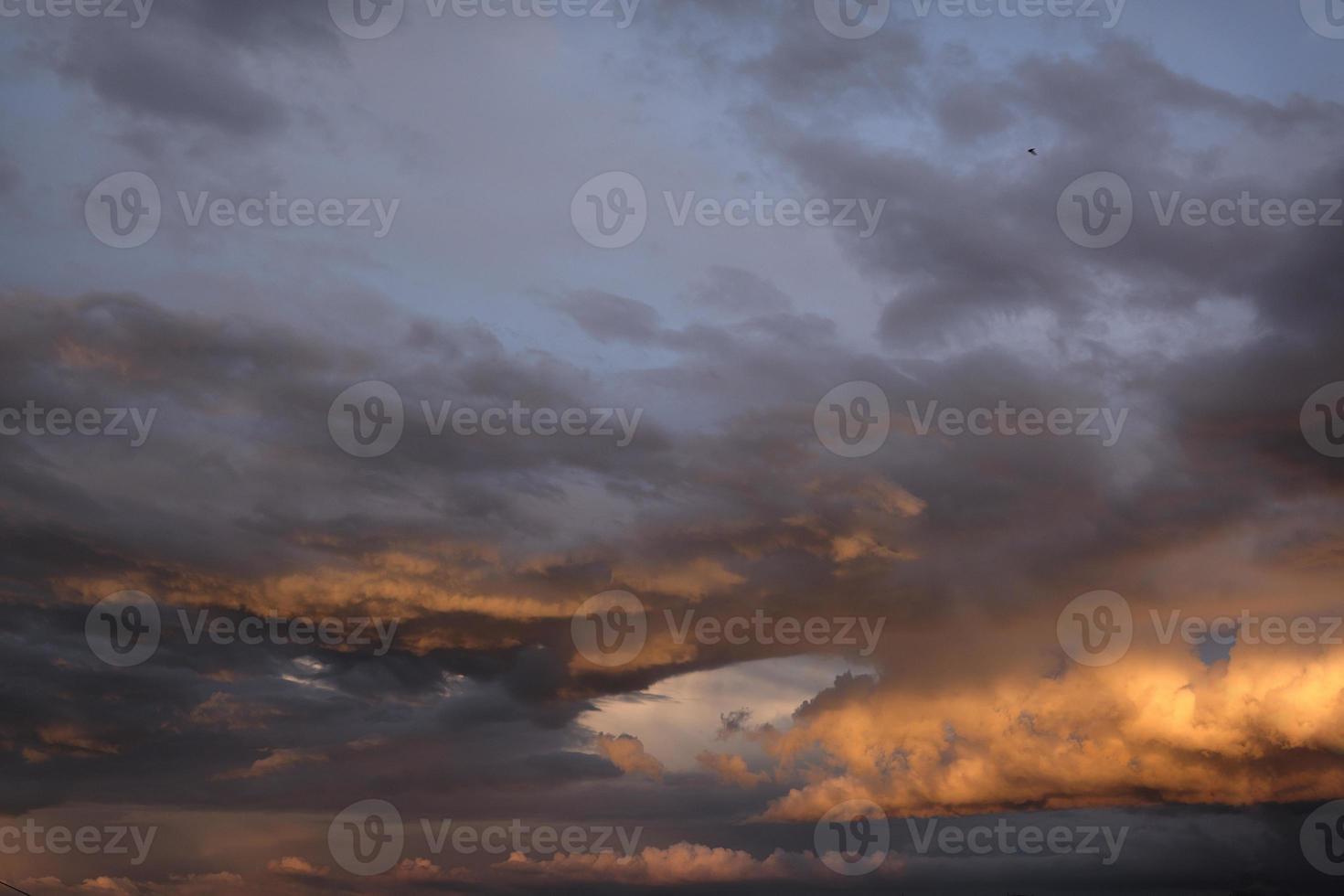 boundless expanse of the sky with cumulus clouds and rays of the sun, moments of daybreak and sunset photo