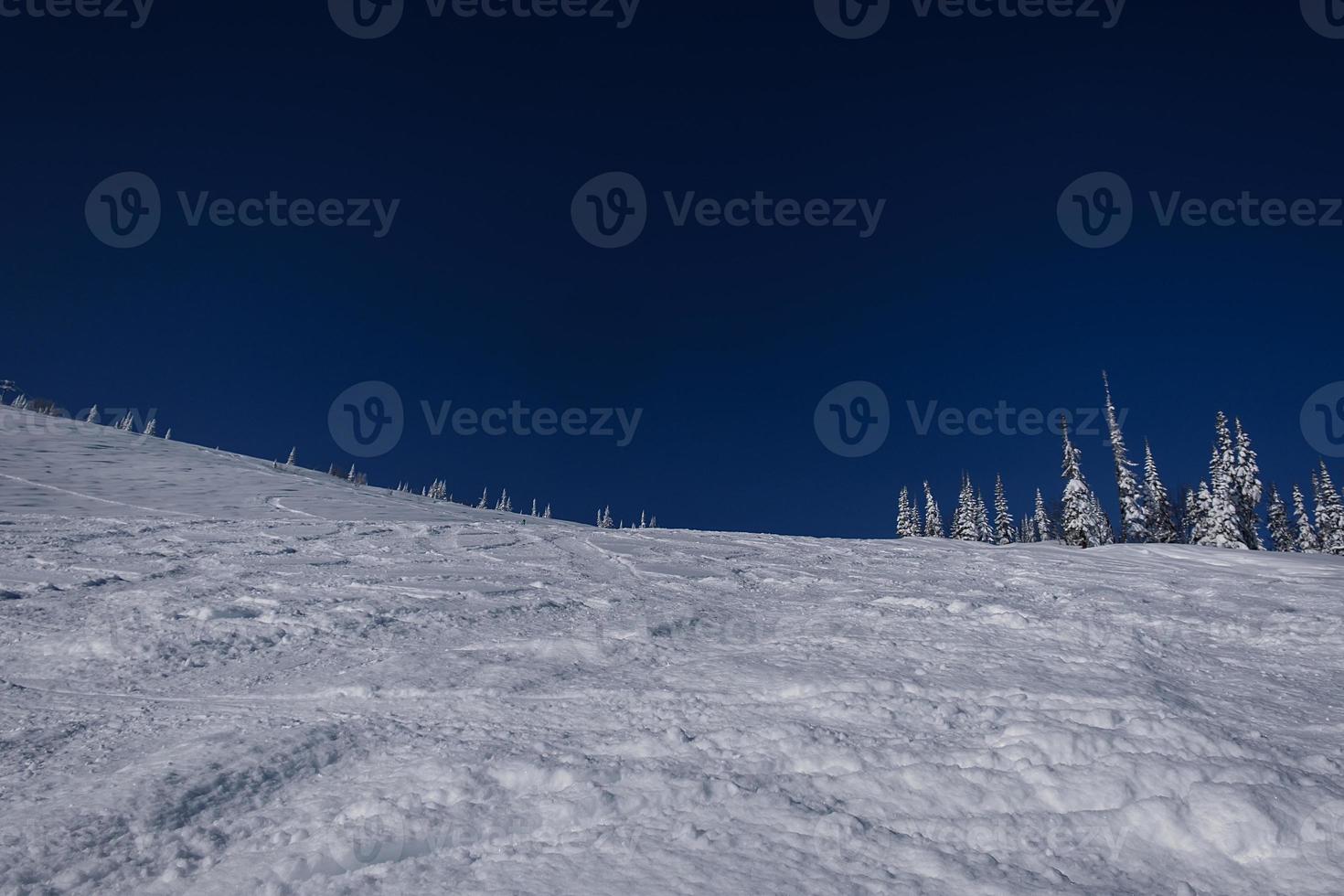 sunny winter morning in the mountains of sheregesh on the ski track photo