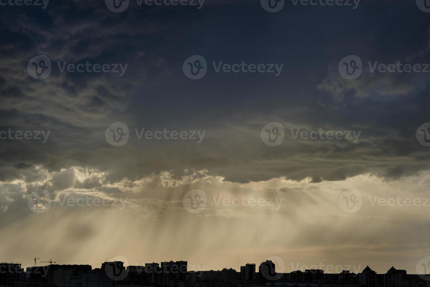 boundless expanse of the sky with cumulus clouds and rays of the sun, moments of daybreak and sunset photo