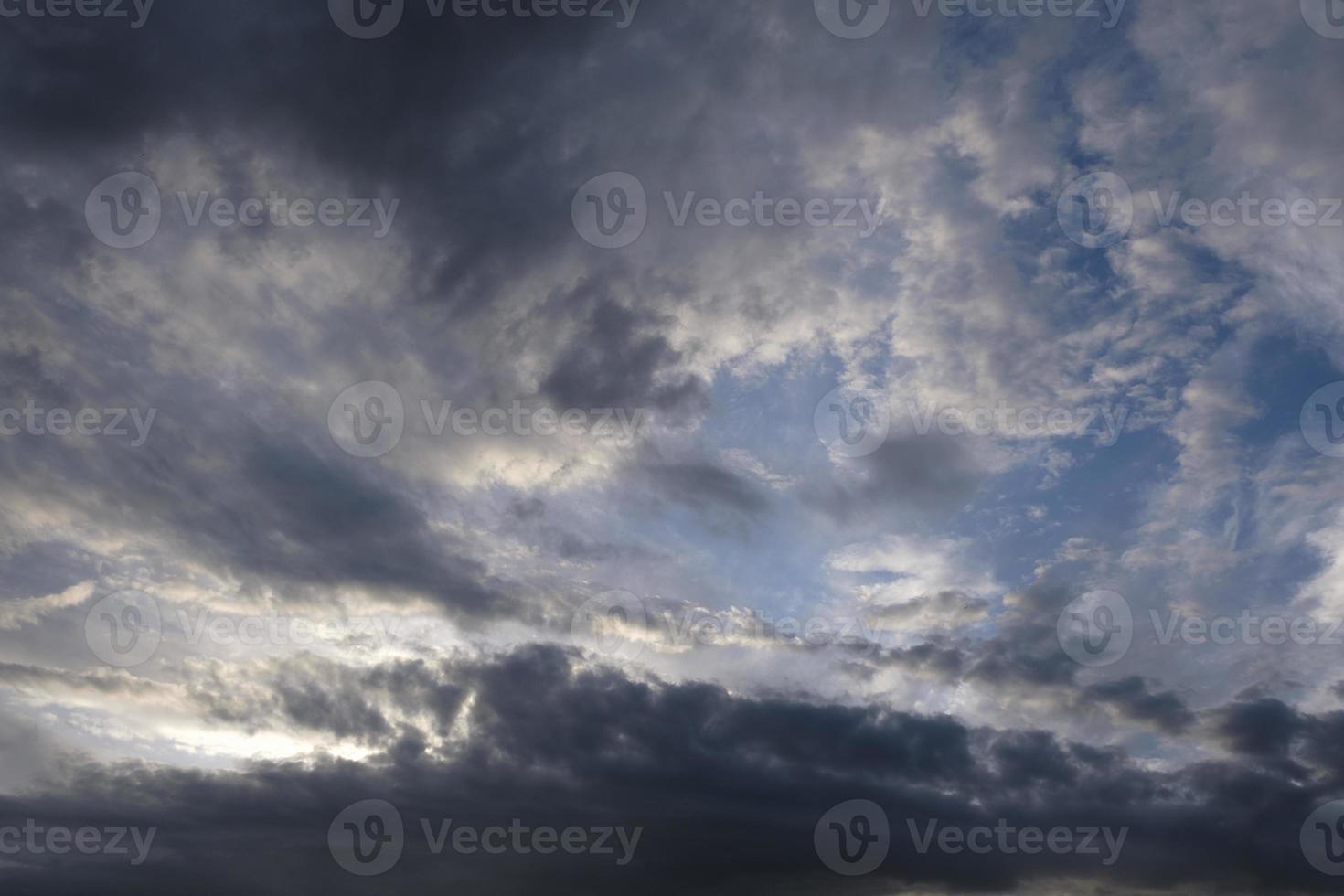 boundless expanse of the sky with cumulus clouds and rays of the sun, moments of daybreak and sunset photo