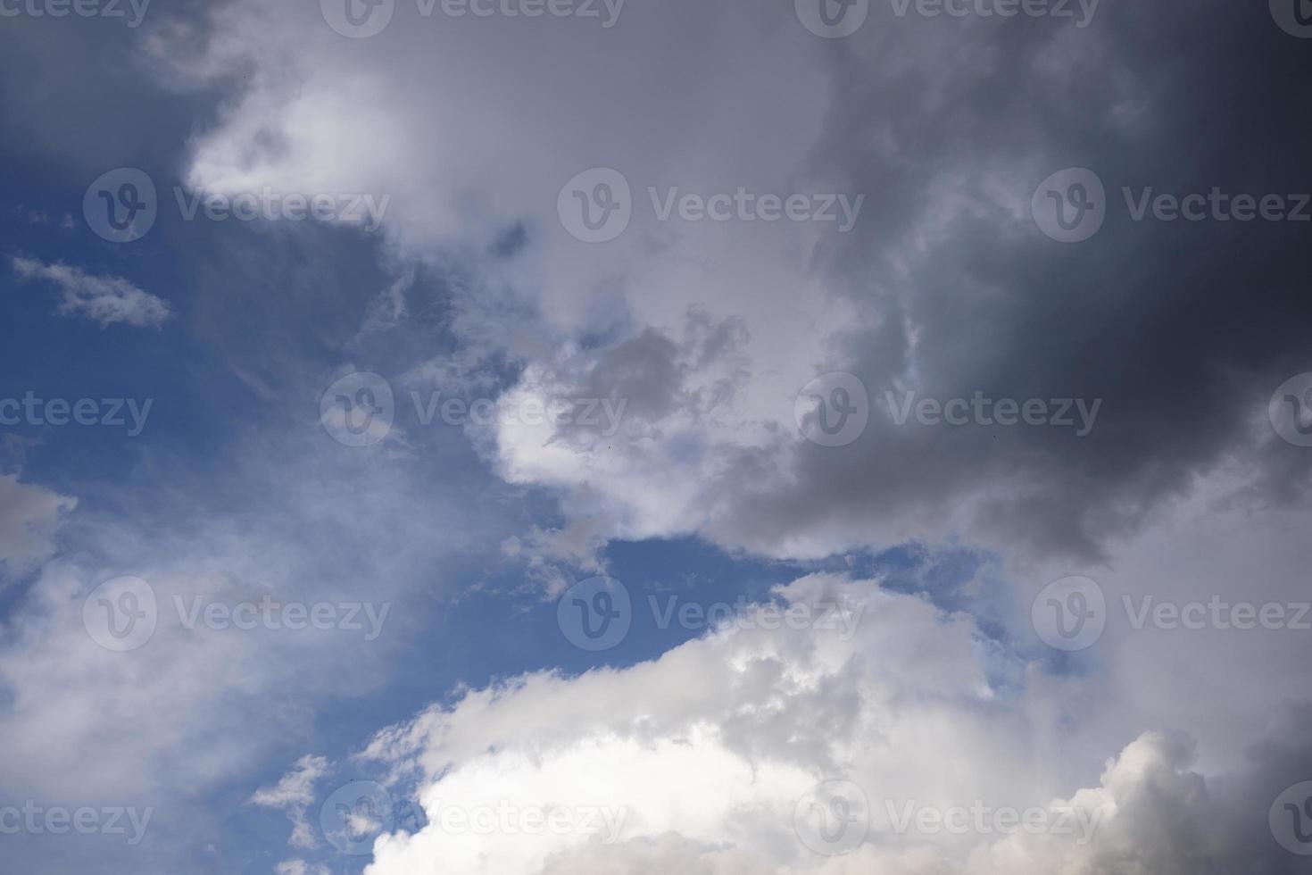 boundless expanse of the sky with cumulus clouds and rays of the sun, moments of daybreak and sunset photo