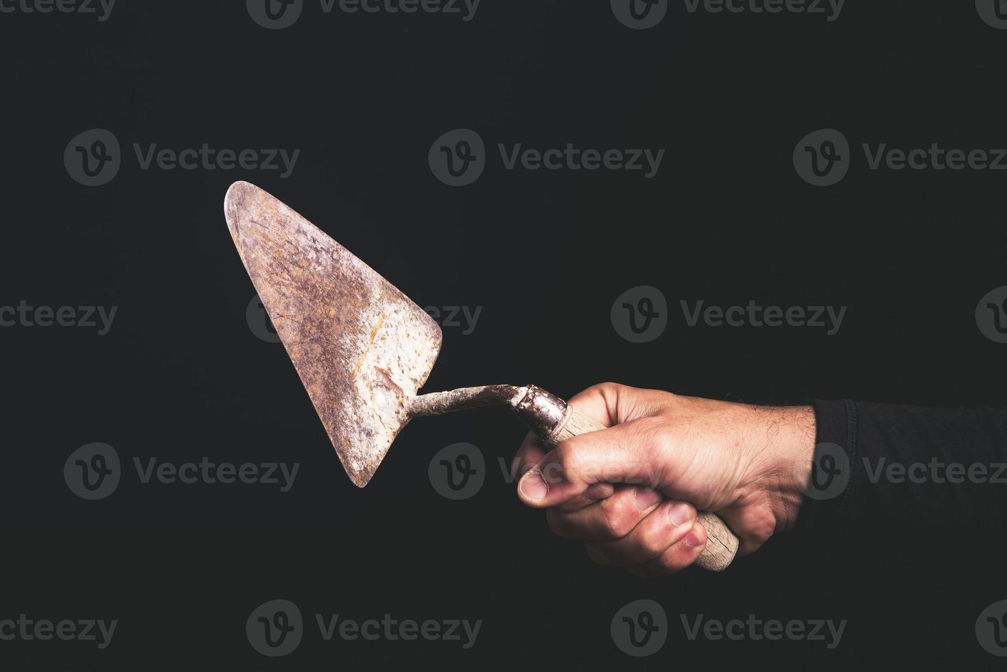 trowel - tools in a man hand - maintenance service concept photo