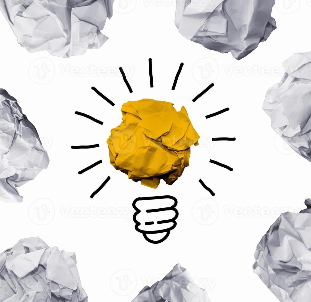Good idea sign concept with paper light bulb isolated in white background. Crumpled paper ball with hand drawin photo