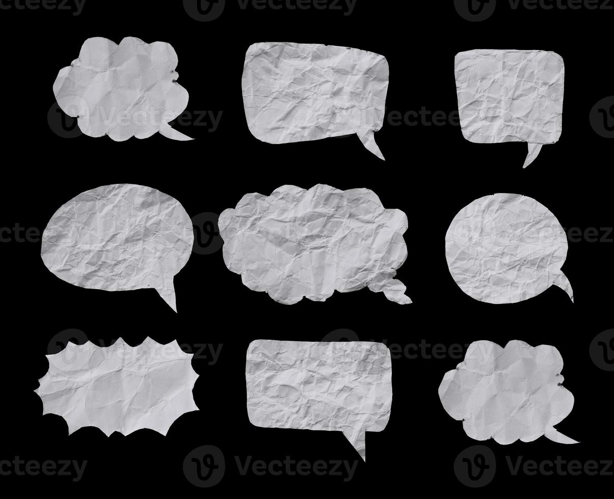 White crumpled paper texture in bubble speech shape. Set of balloon text isolated in black background. photo