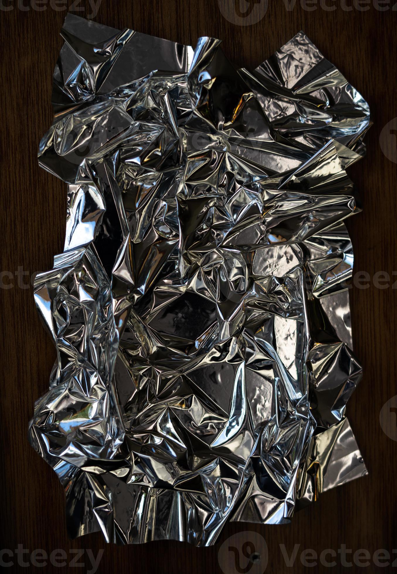Blank glued aluminum foil texture for background and wallpaper