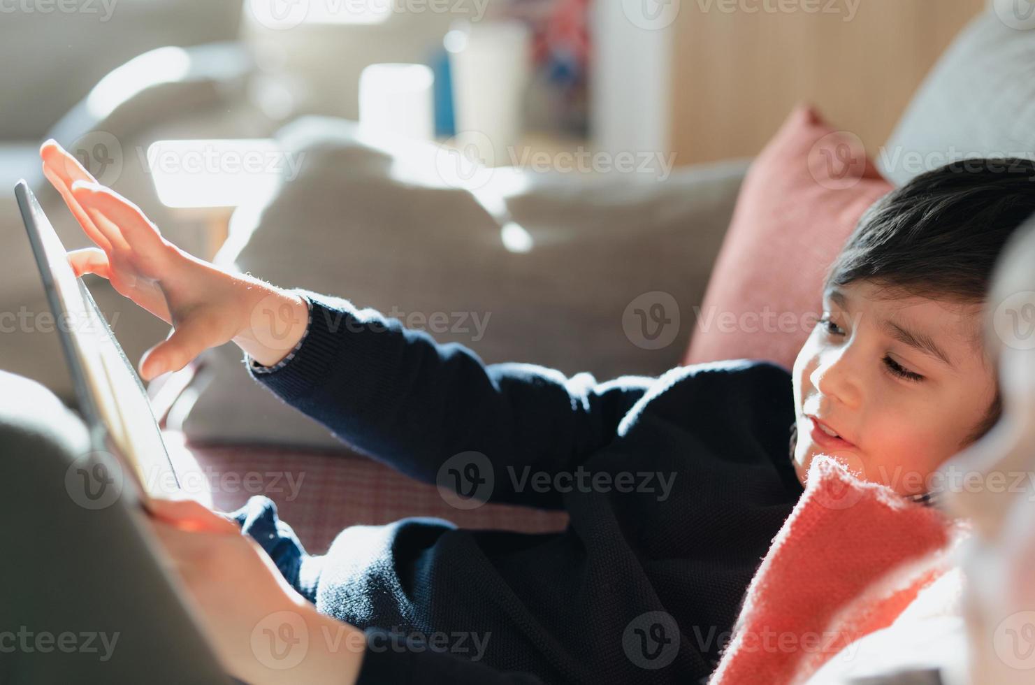 Little Boy Playing Car Game On Computer At Home Stock Photo