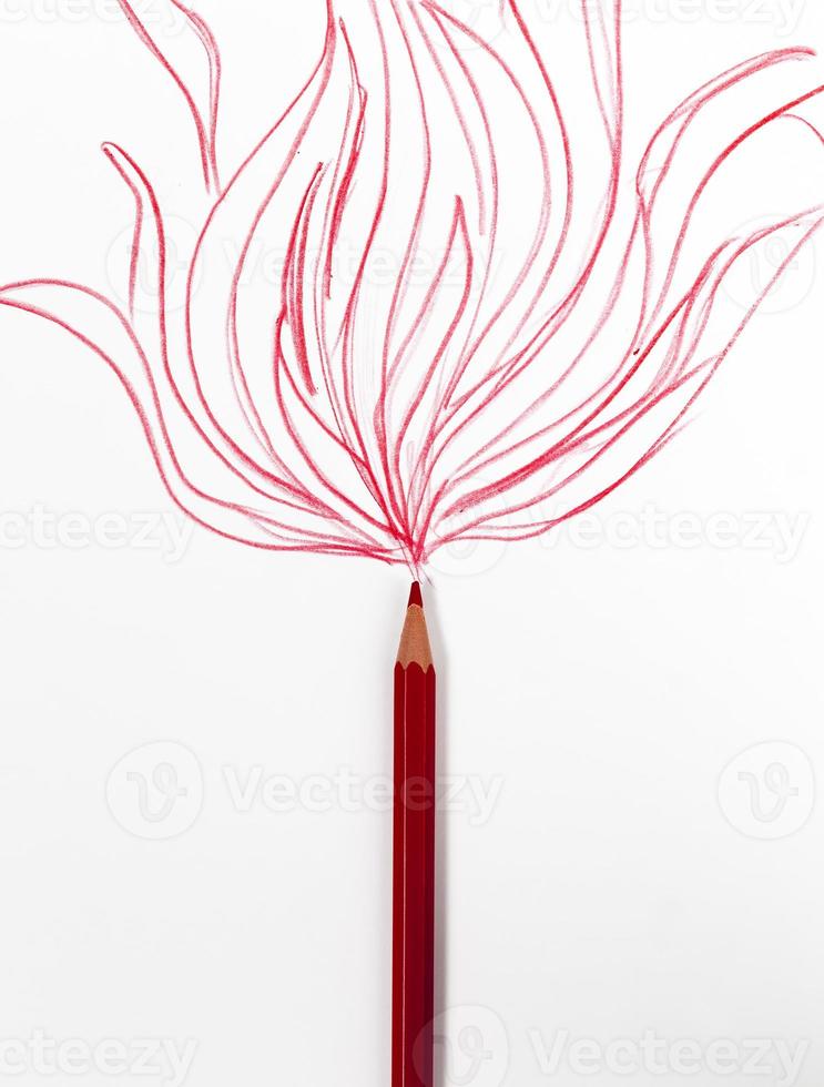 chaotic lines in red pencil on ordinary paper photo