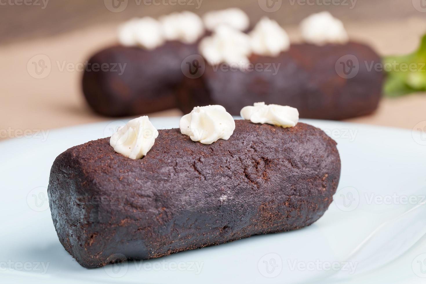 cake is covered with a layer of powdered sugar with cocoa photo
