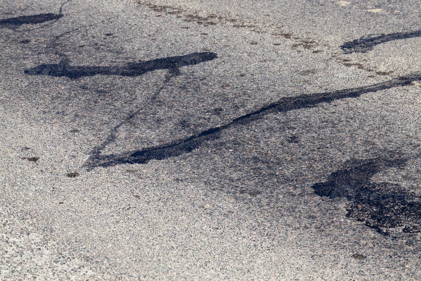 part of an asphalt road with damage photo