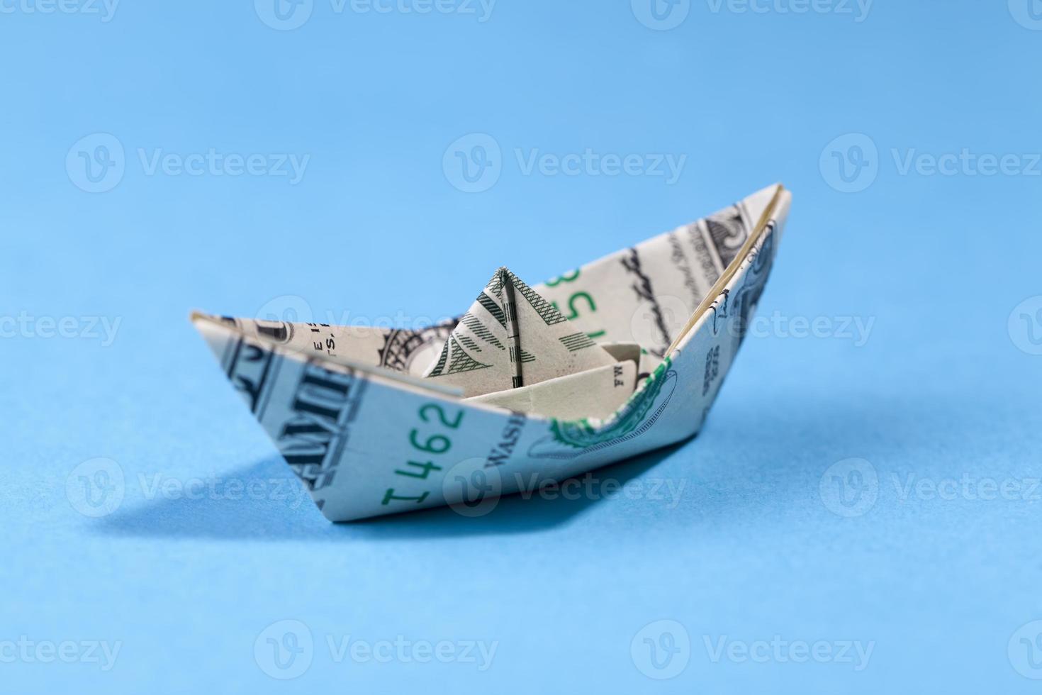 paper boat made of one american dollar photo