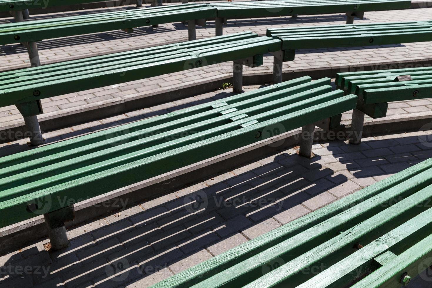 old wooden benches of green color photo