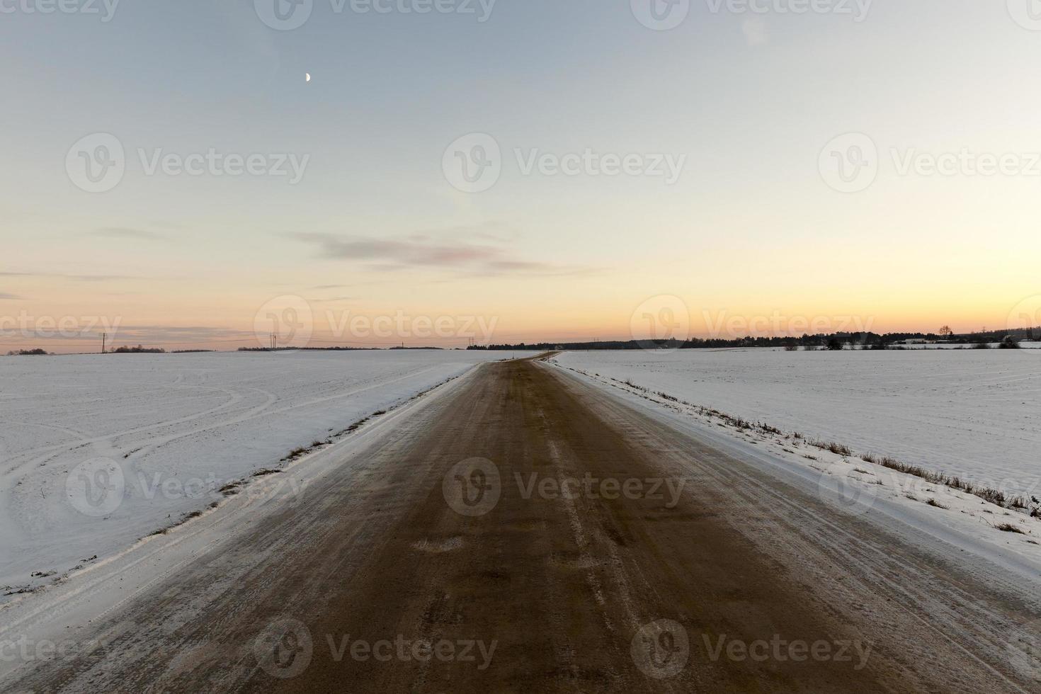 Ruts on a snow covered road photo