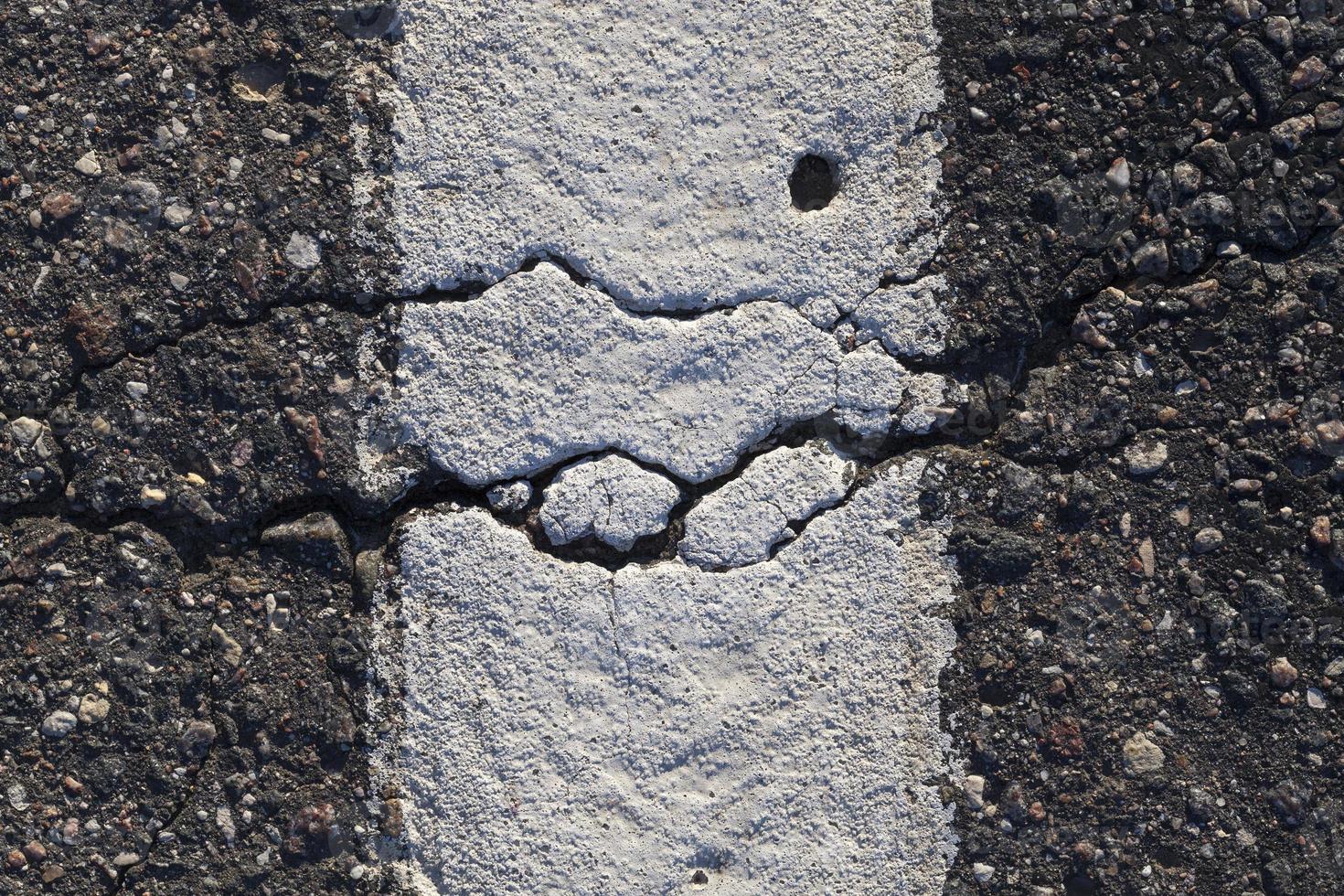 crack on an asphalt road photo