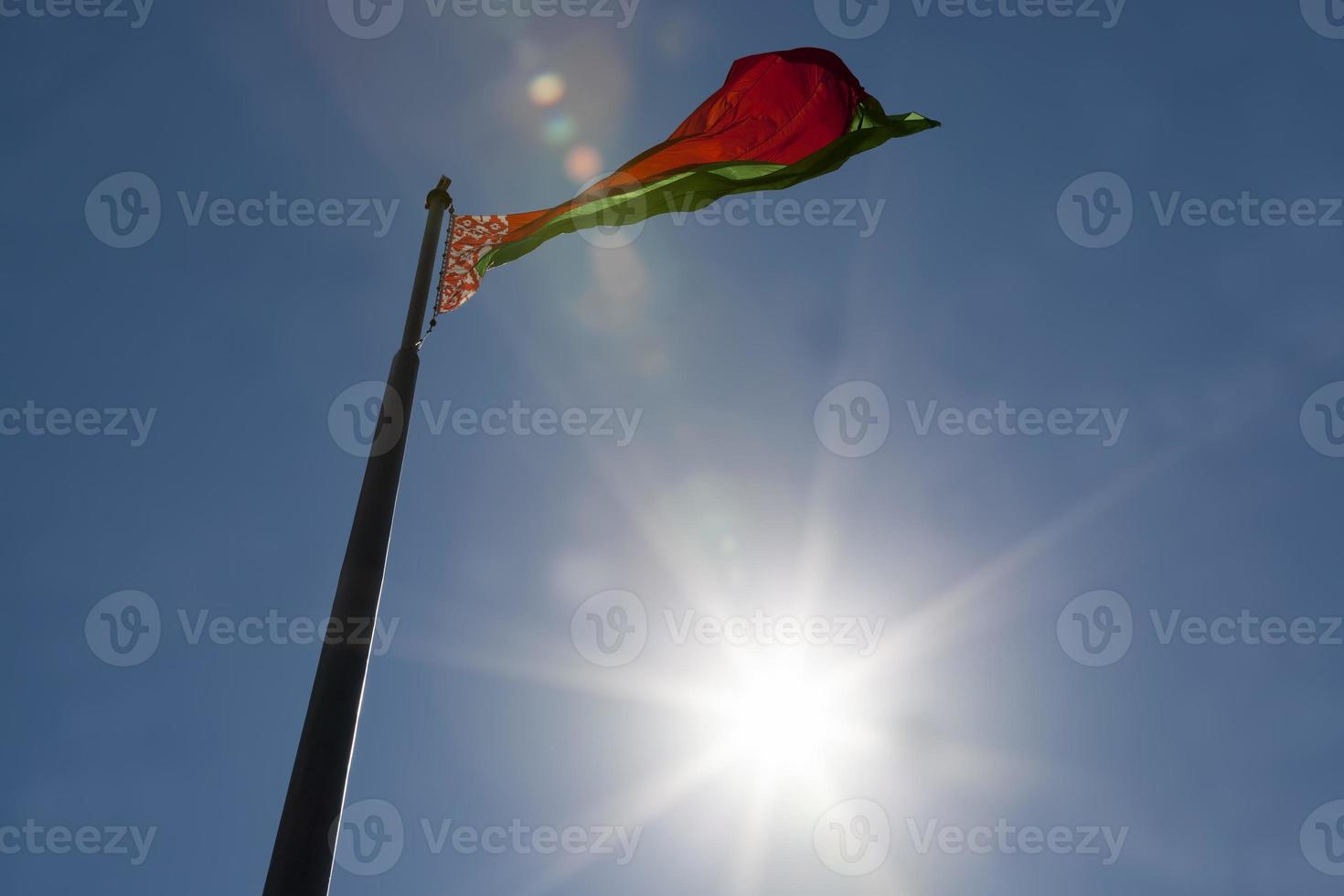 belarusian state flag on a blue sky photo