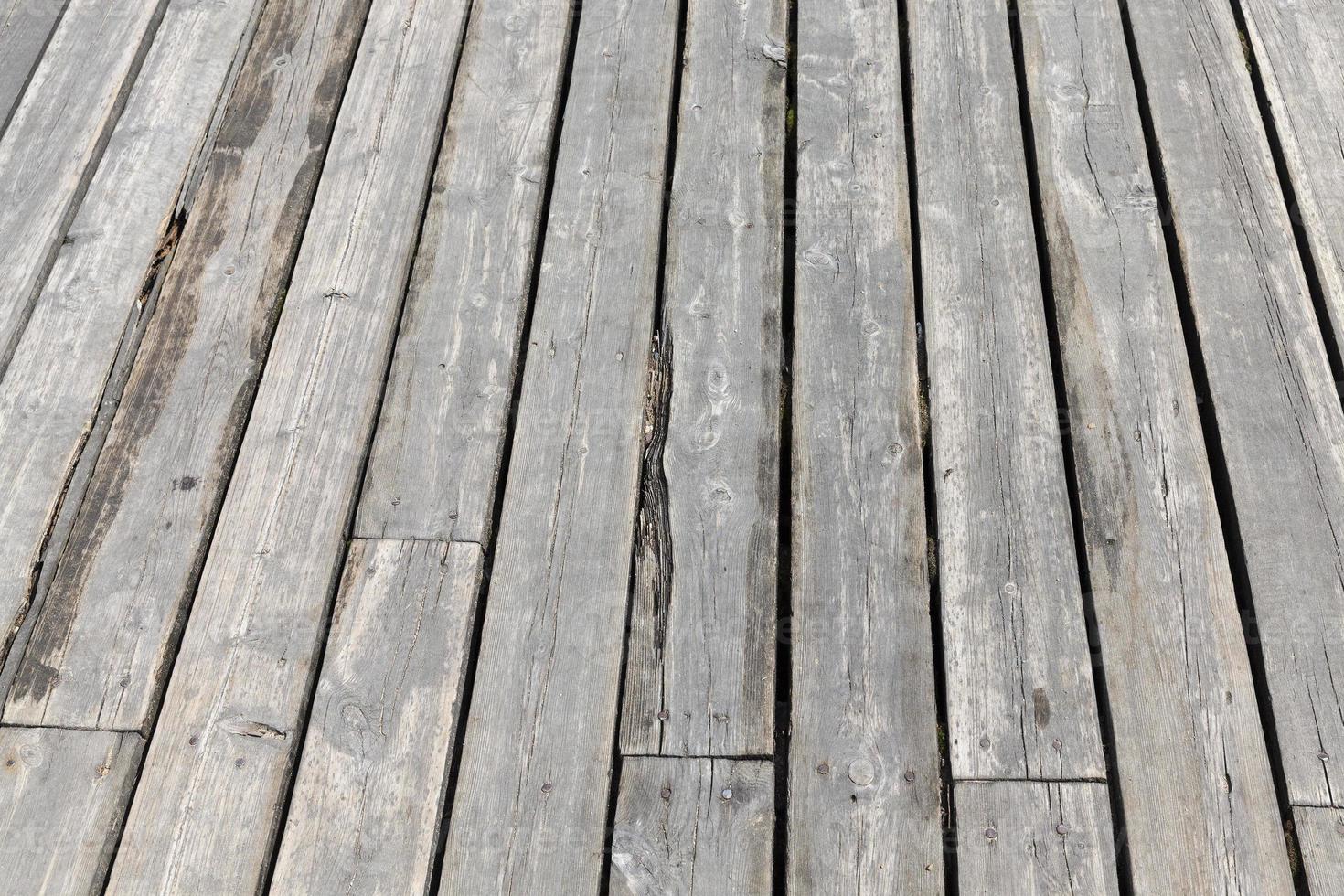 a wooden pier by the lake photo