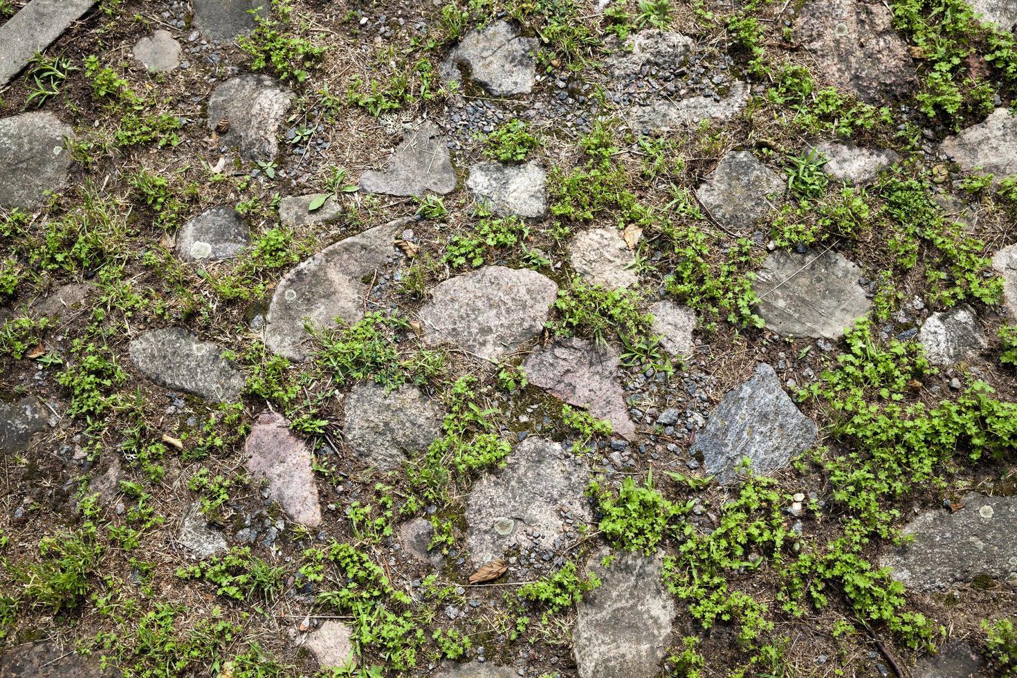 the old road is made of stones and cobblestones photo