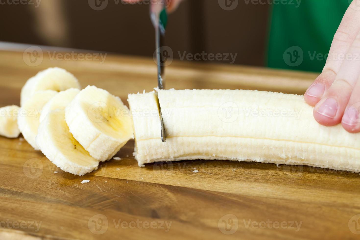 making smoothies with yellow banana photo