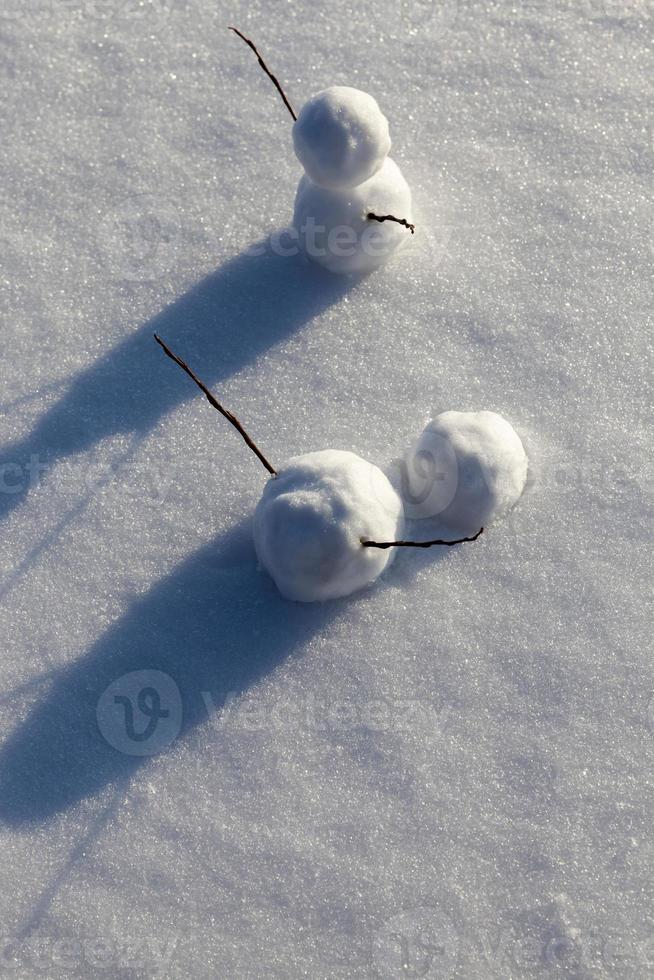 snowmen made of snow in winter photo