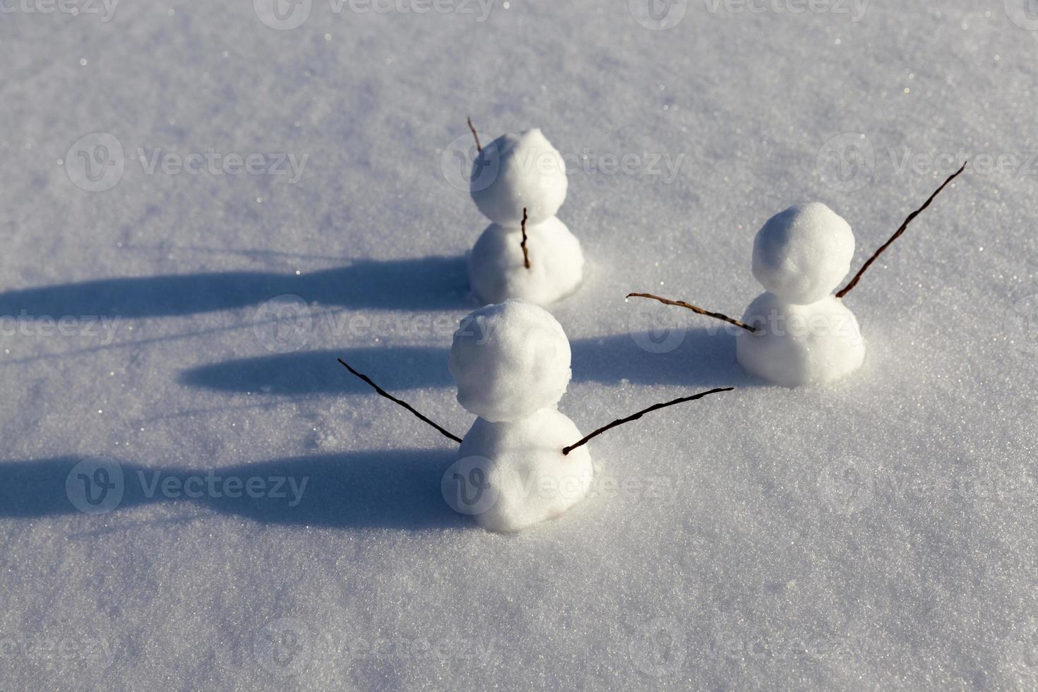 snowmen made of snow in winter photo