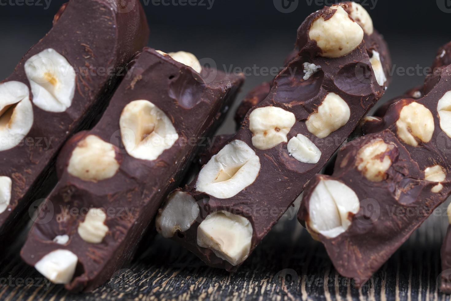 bitter chocolate with hazelnuts, homemade 9716510 Stock Photo at Vecteezy