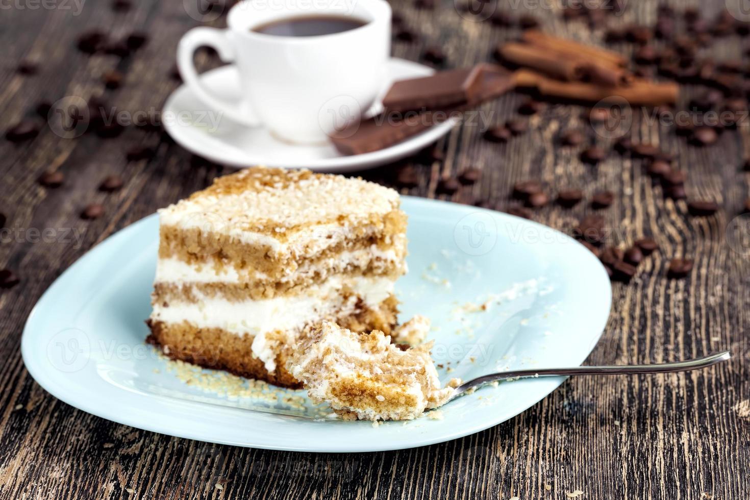 delicious cake cut into pieces, multi layer pastry with photo