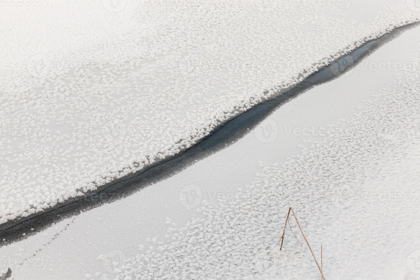 river covered with ice and snow photo