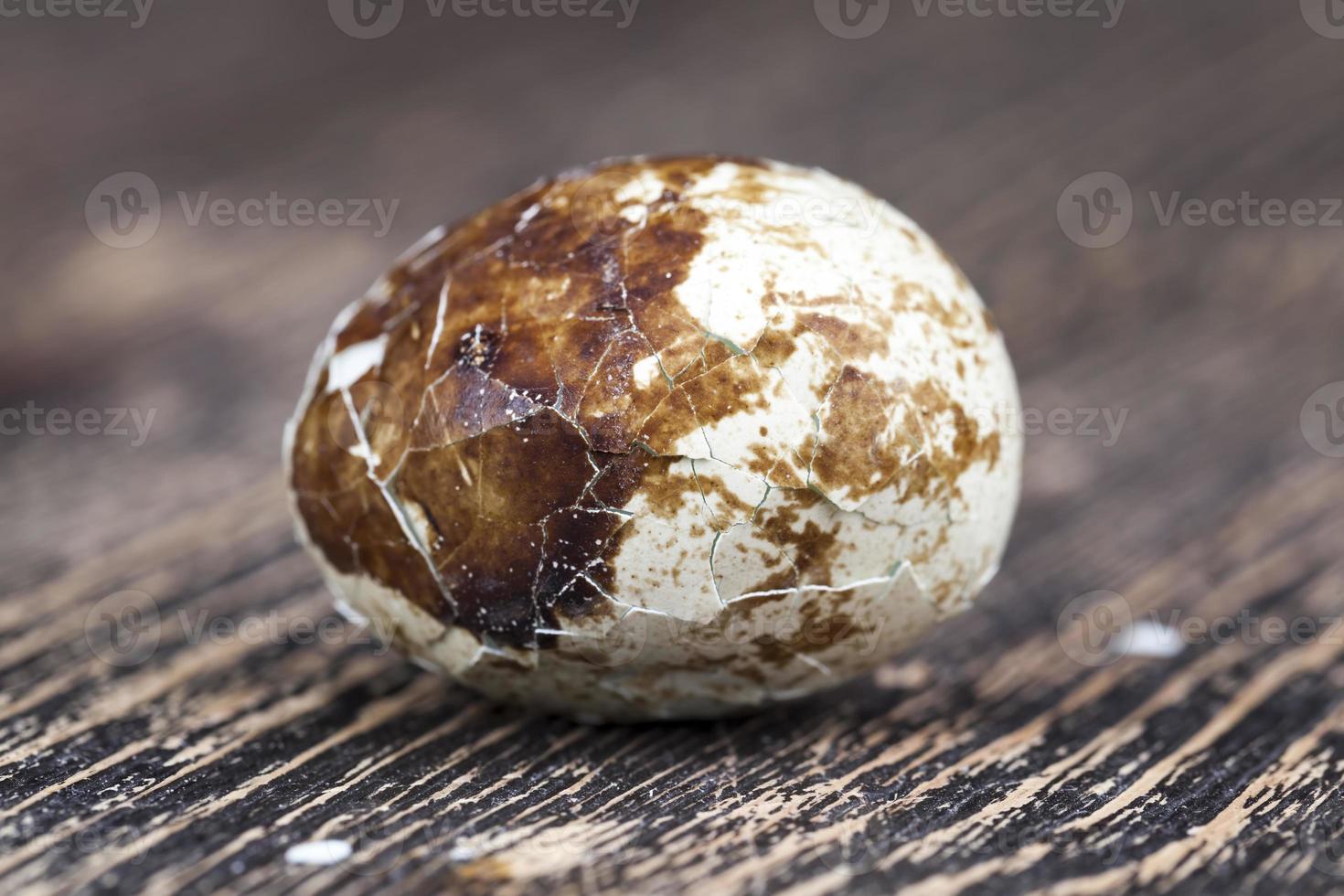 boiled quail egg on a wooden table photo