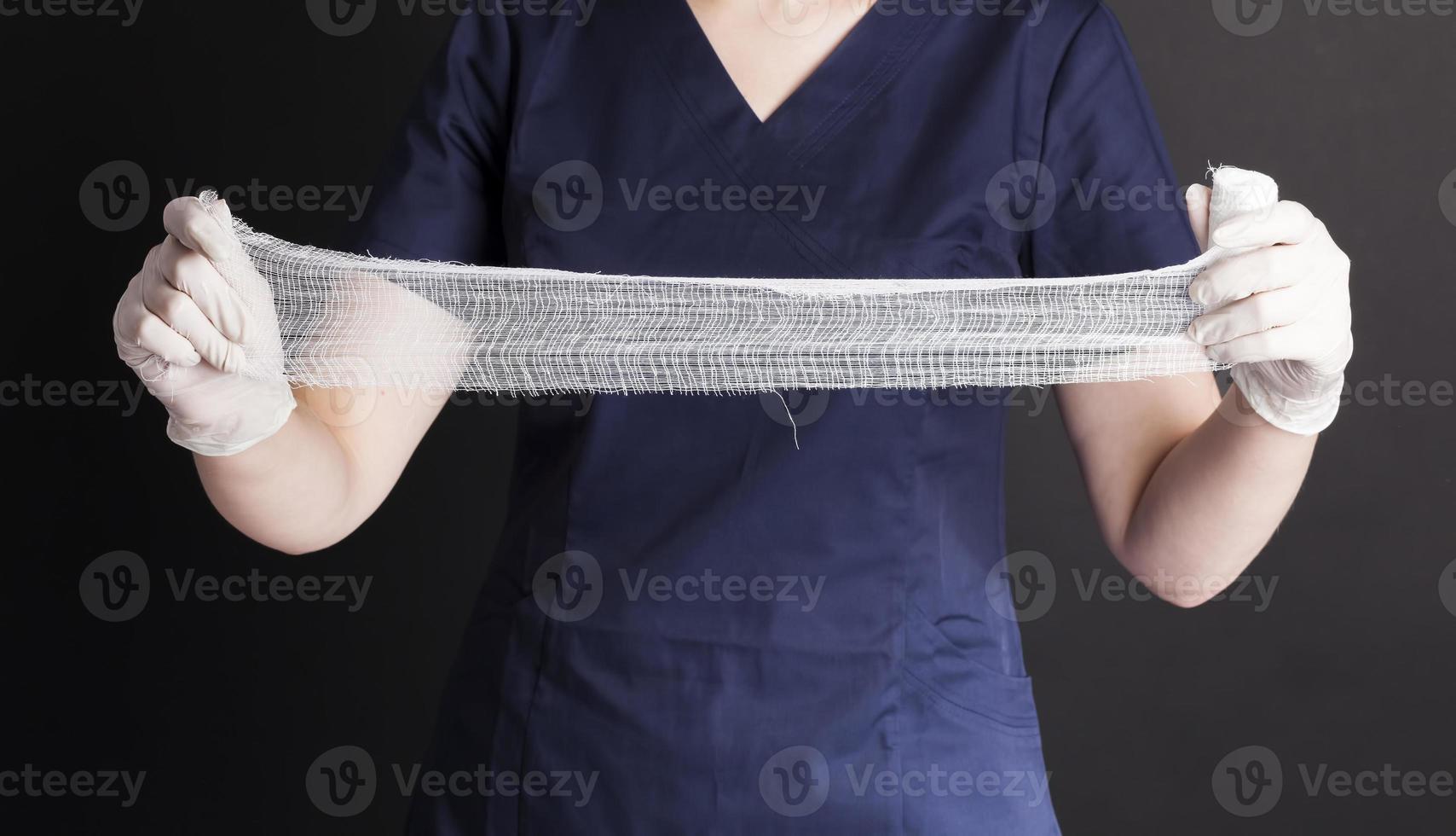 medical white bandage in the hands photo