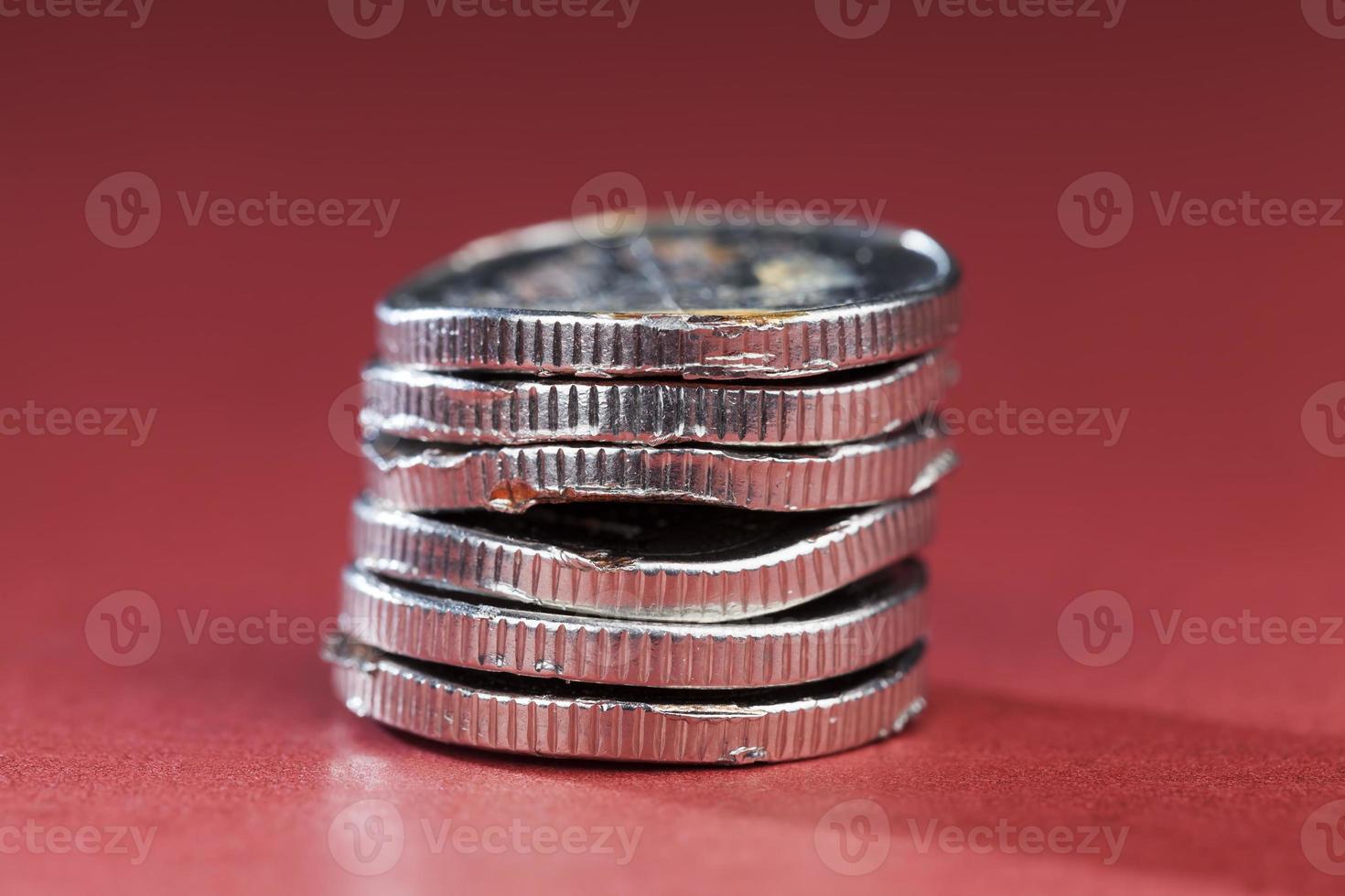 broken bent and rusting metal coins photo