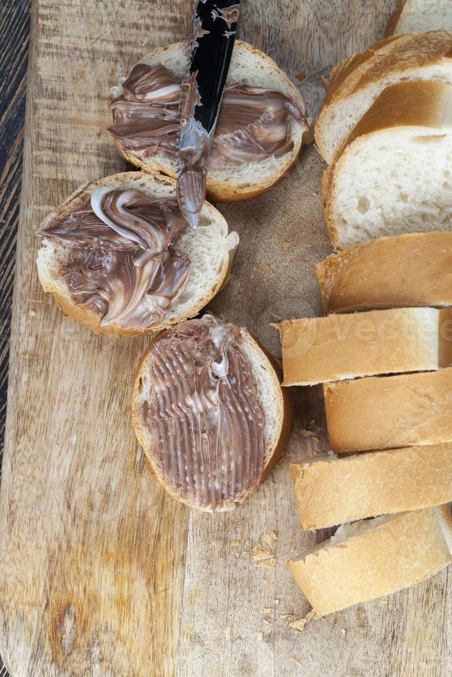 natural cocoa chocolate paste during Breakfast with baguette photo