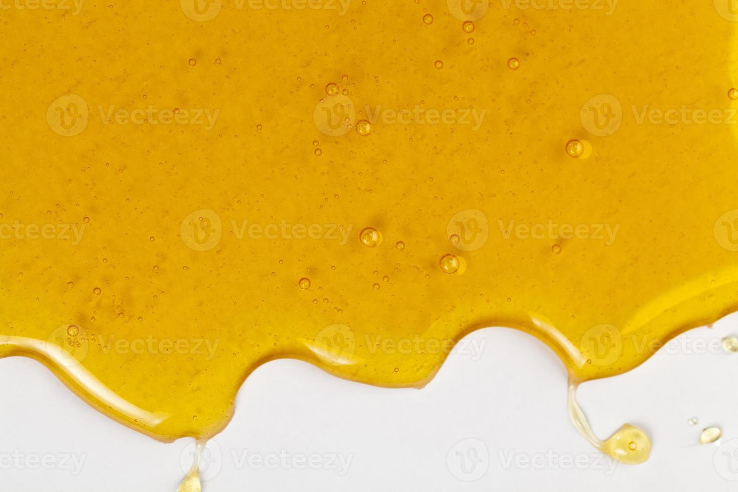 natural viscous honey, which is produced by honey bees photo