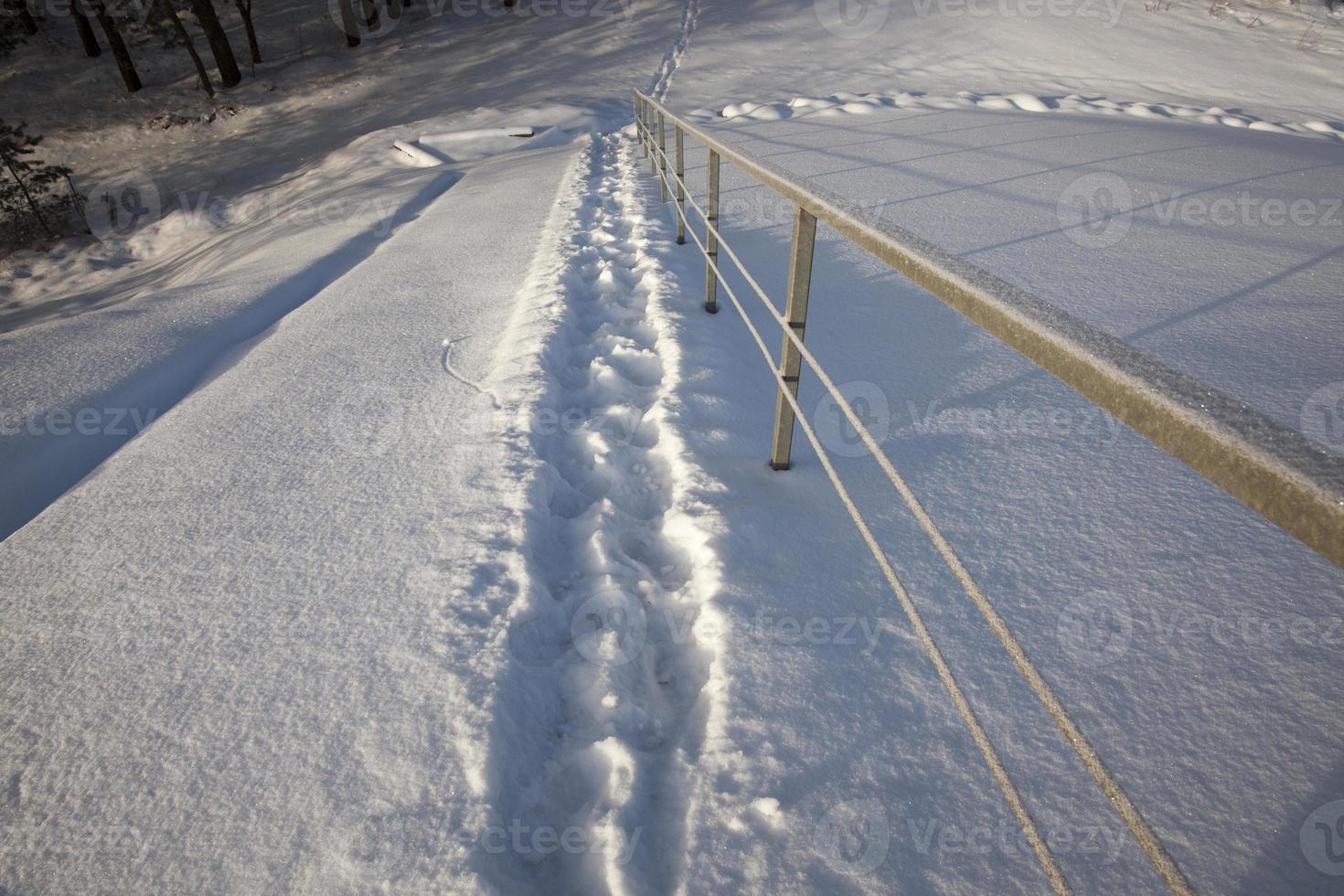 footprints on snowdrifts after walking photo