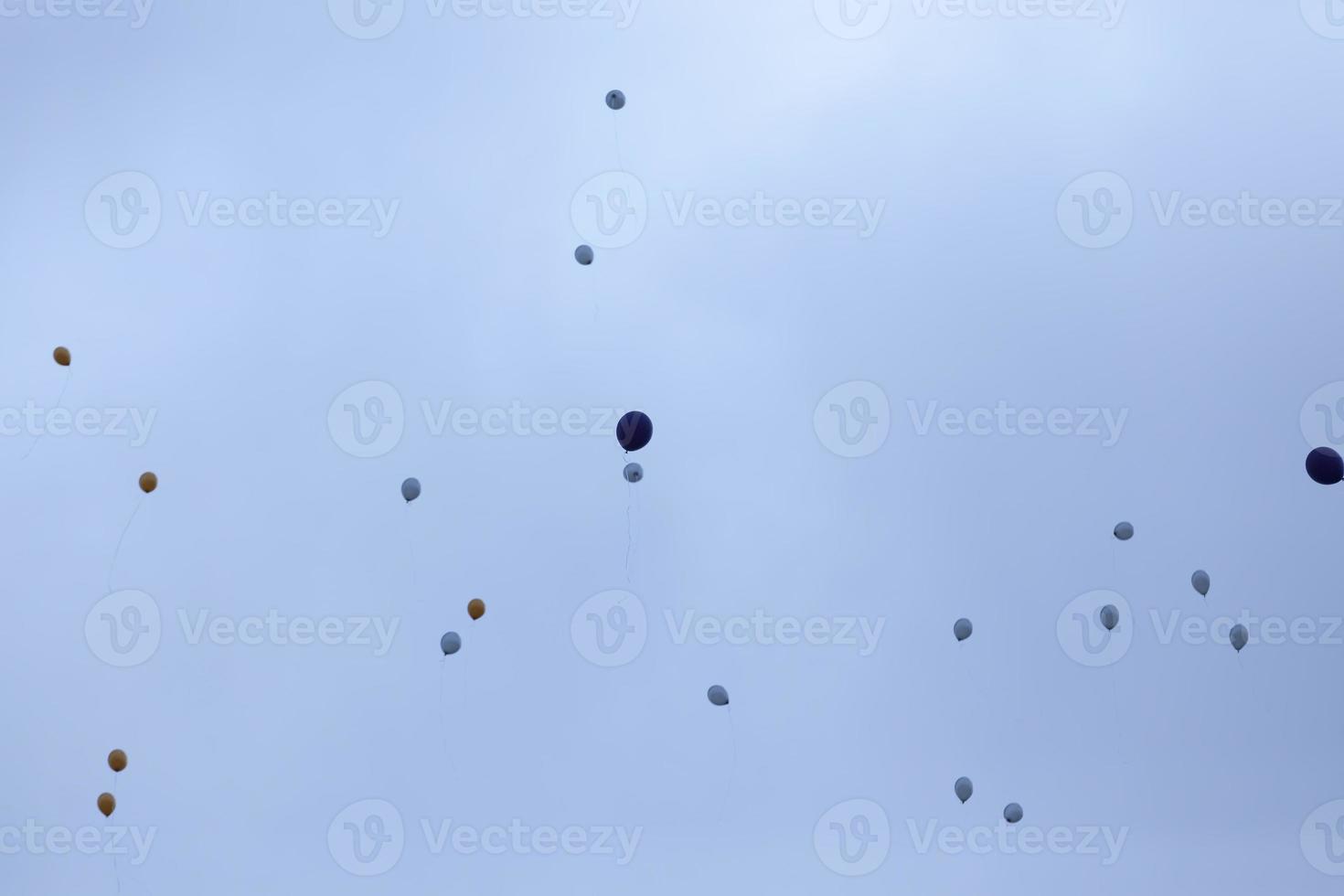 balloons with helium in sky photo