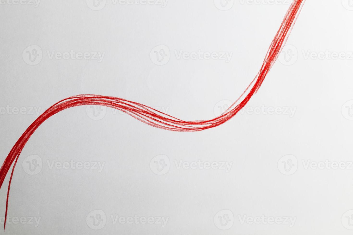 chaotic lines in red pencil on ordinary paper photo