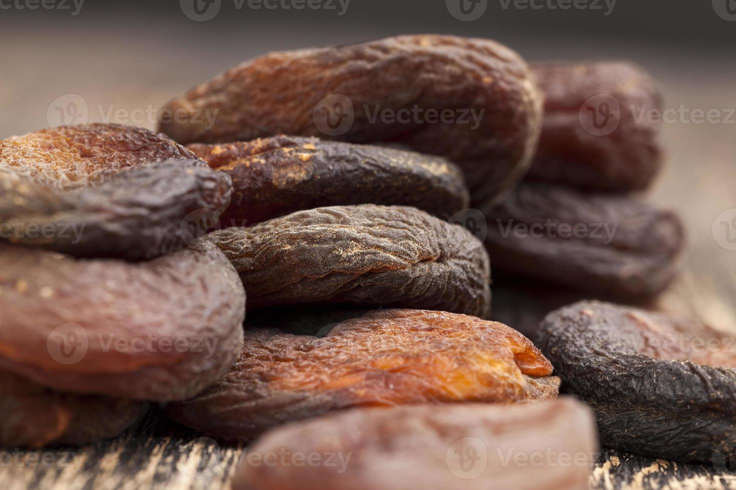 dark dried apricots of large size 9718906 Stock Photo at Vecteezy