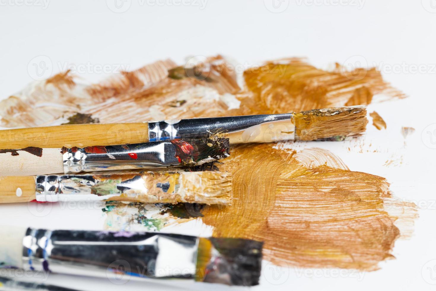 art brushes smeared in paints photo