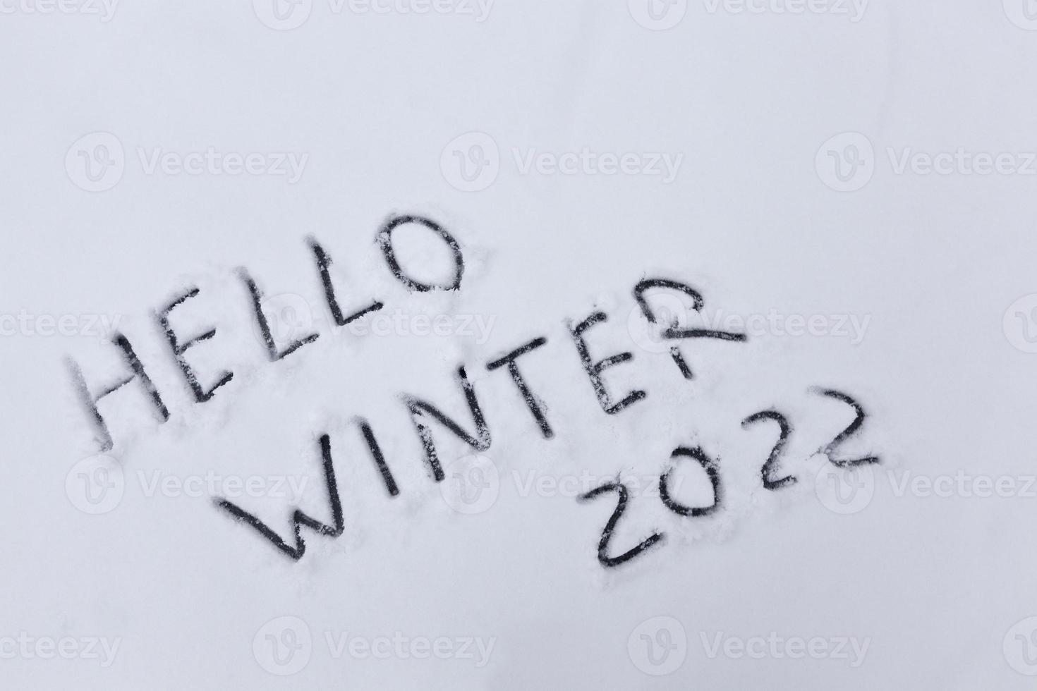 the word winter on the snow in the winter season photo