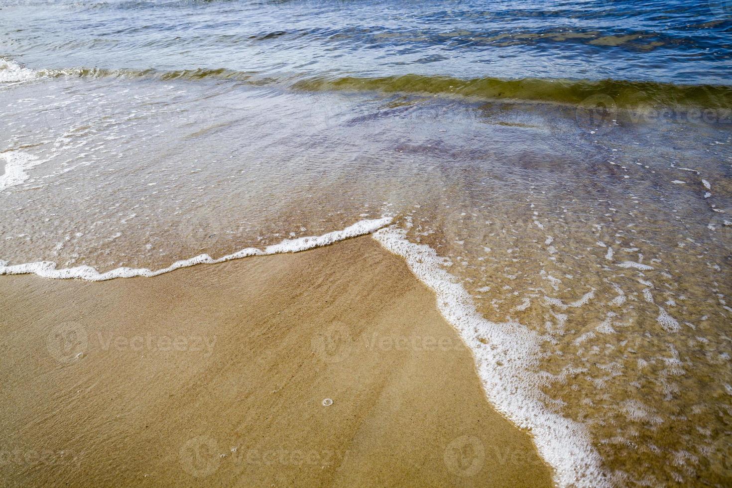 sea coast with lots of waves from windy weather photo