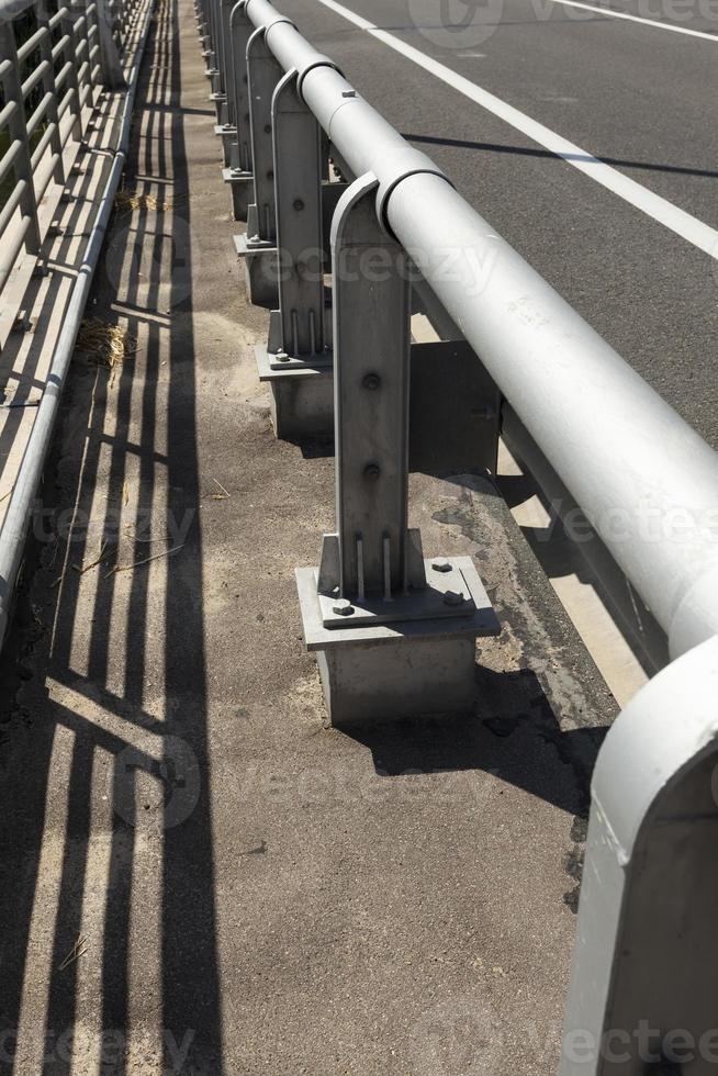 steel fences on the road to ensure the safety of cars photo