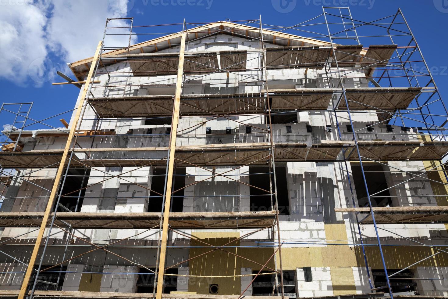 building a new home on the building scaffolding photo