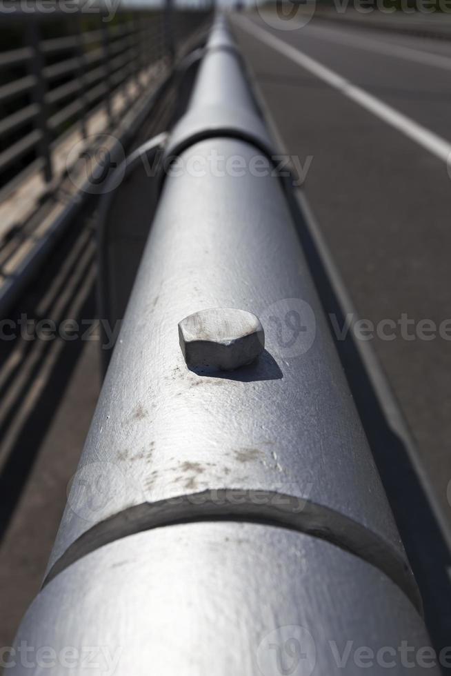 steel fences on the road to ensure the safety of cars photo