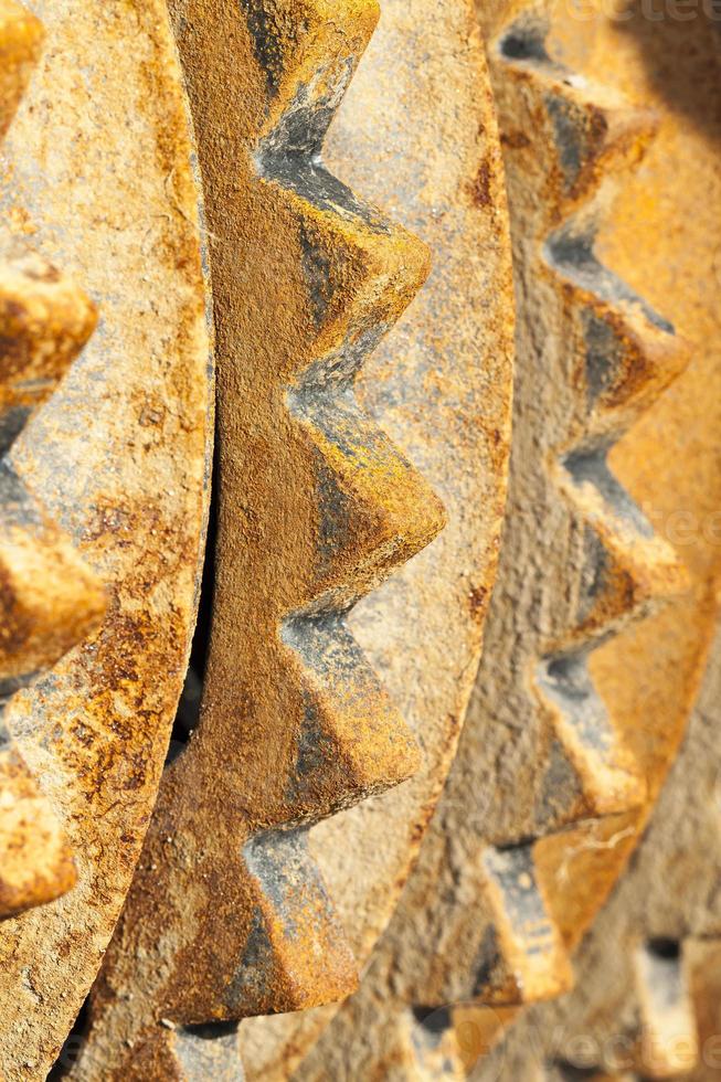 rusty metal element of the agricultural plow close up photo