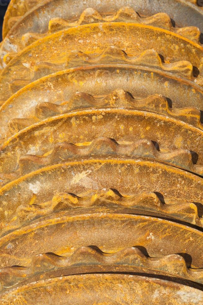 rusty metal element of the agricultural plow close up photo