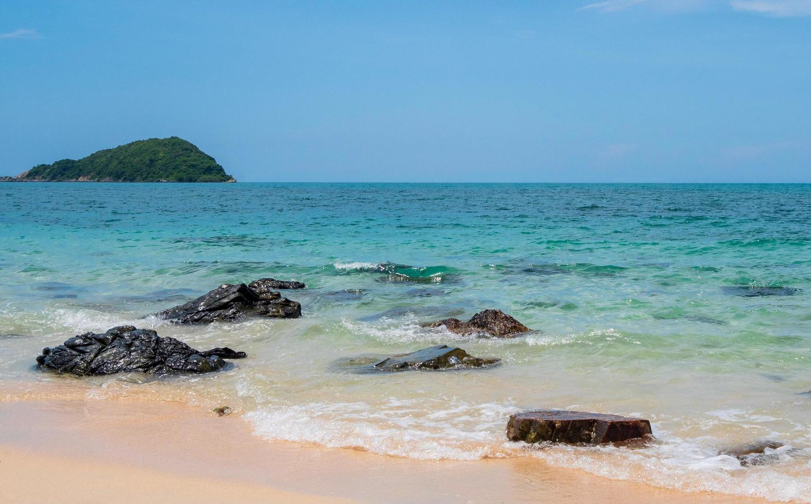 Landscape summer view  tropical sea beach rock blue sky white sand background calm Nature ocean Beautiful wave crash splashing water travel Nang Ram Beach East thailand Chonburi Exotic horizon. photo