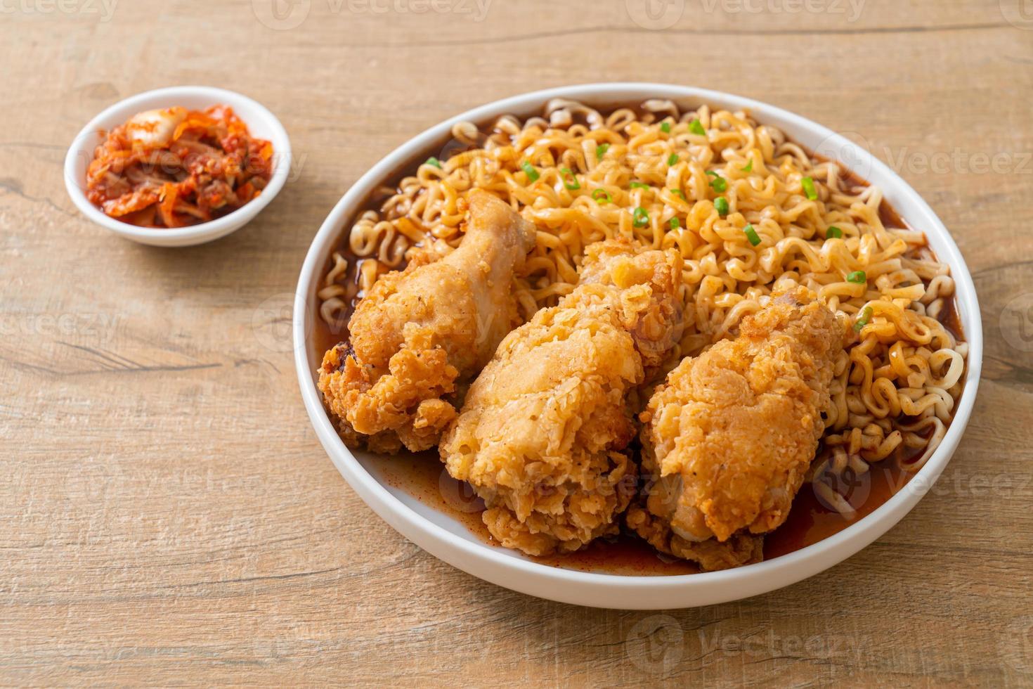 Korean instant noodles with fried chicken or Fried chicken ramyeon photo