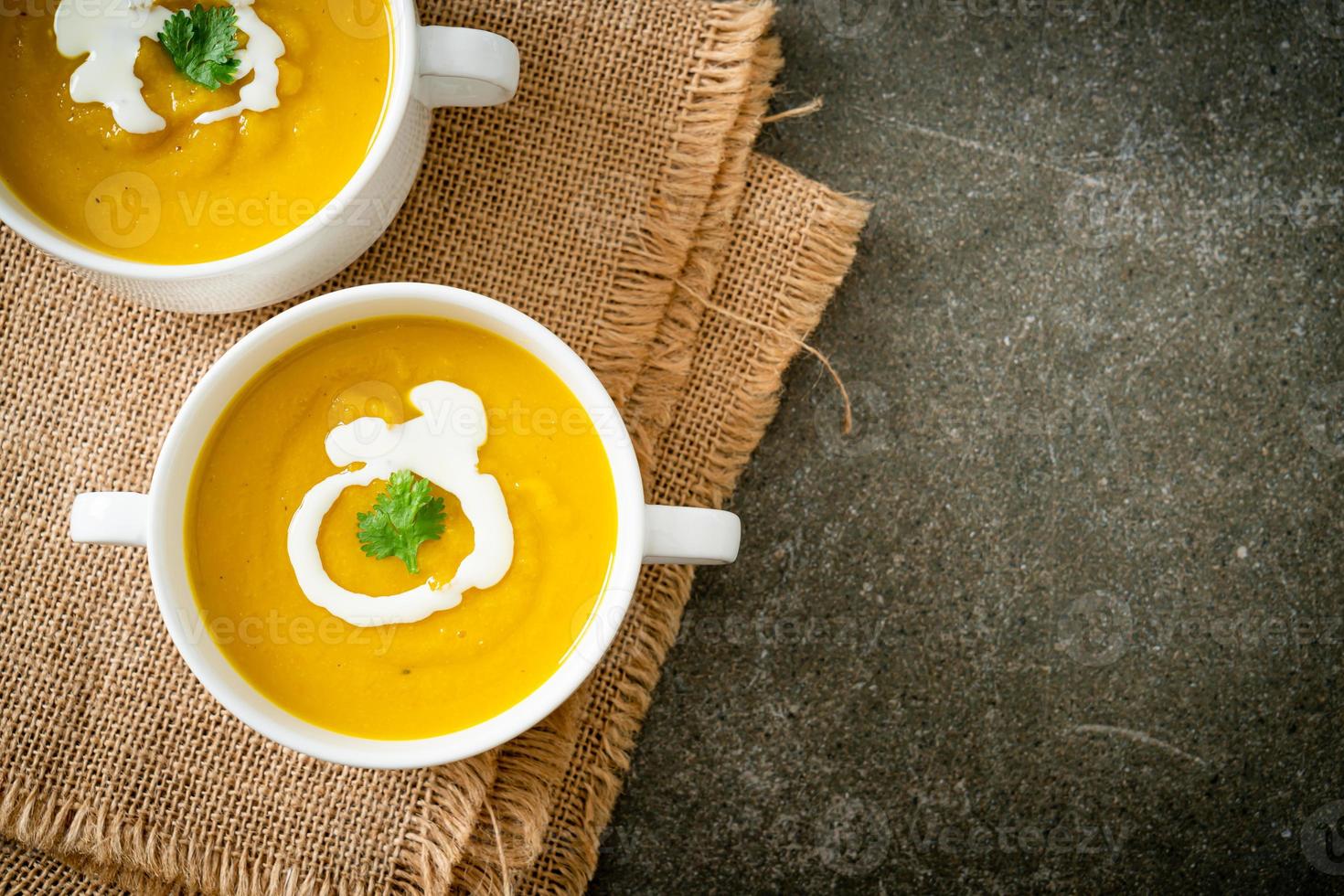 pumpkin soup in white bowl photo
