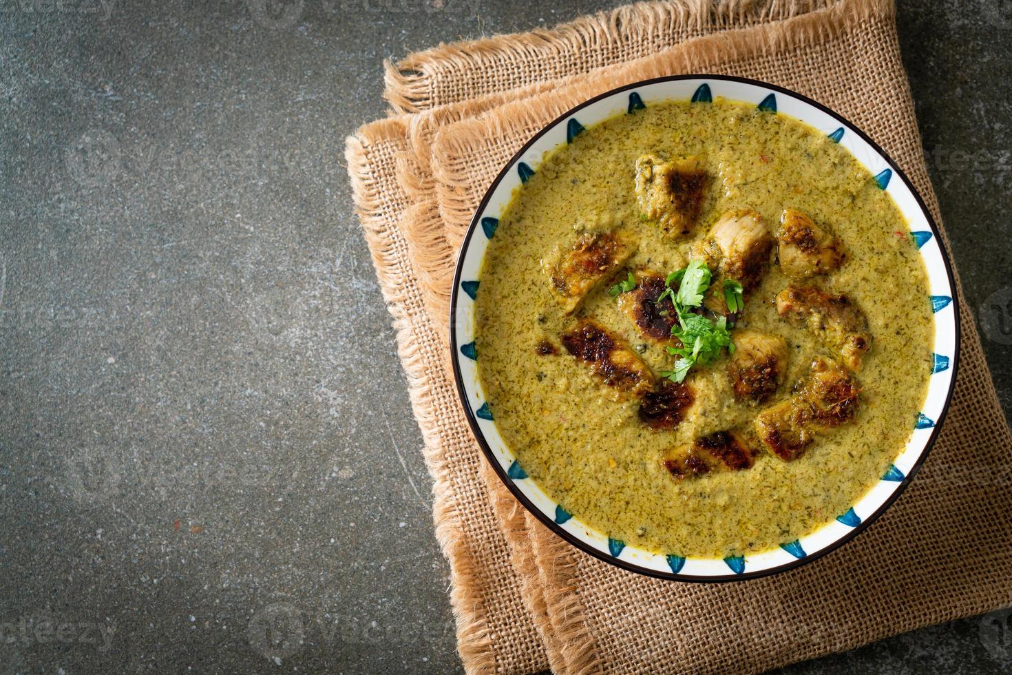 Afghani chicken in green curry or Hariyali tikka chicken hara masala photo