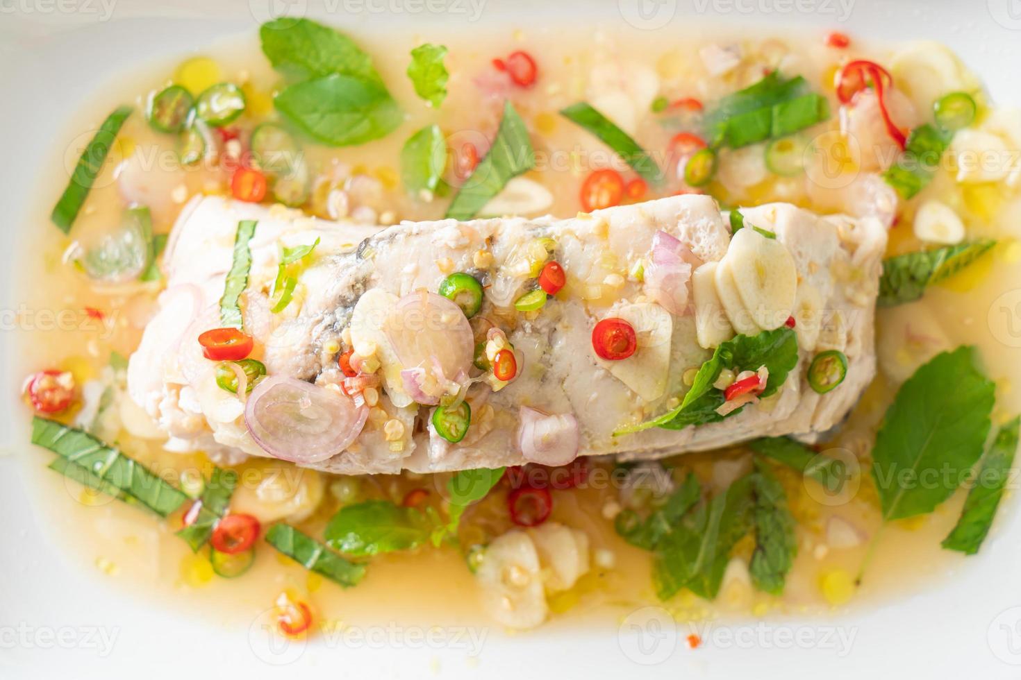 steamed sea bass fish with herbs 9724516 Stock Photo at Vecteezy
