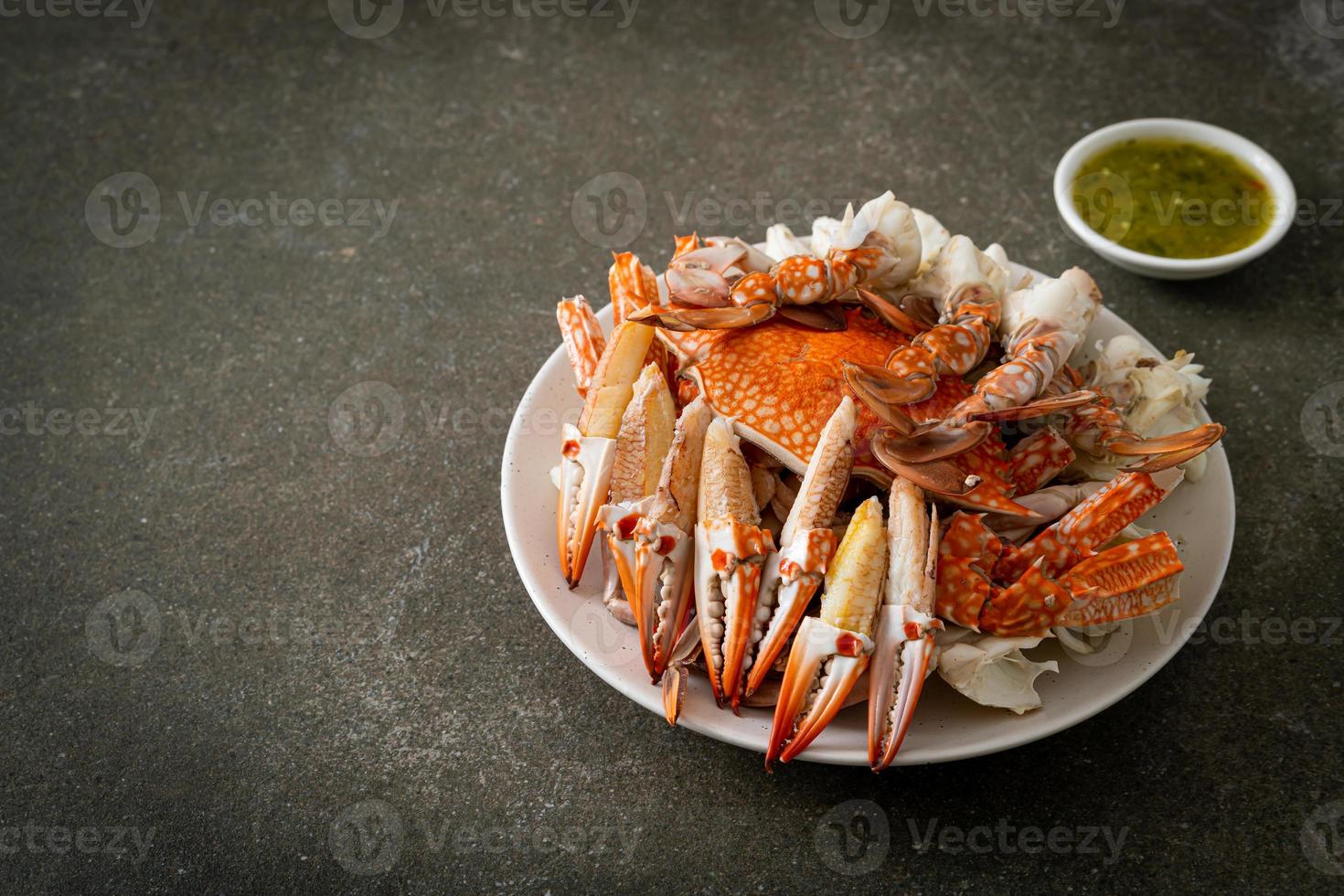 Steamed blue crab with spicy seafood sauce 9724537 Stock Photo at Vecteezy