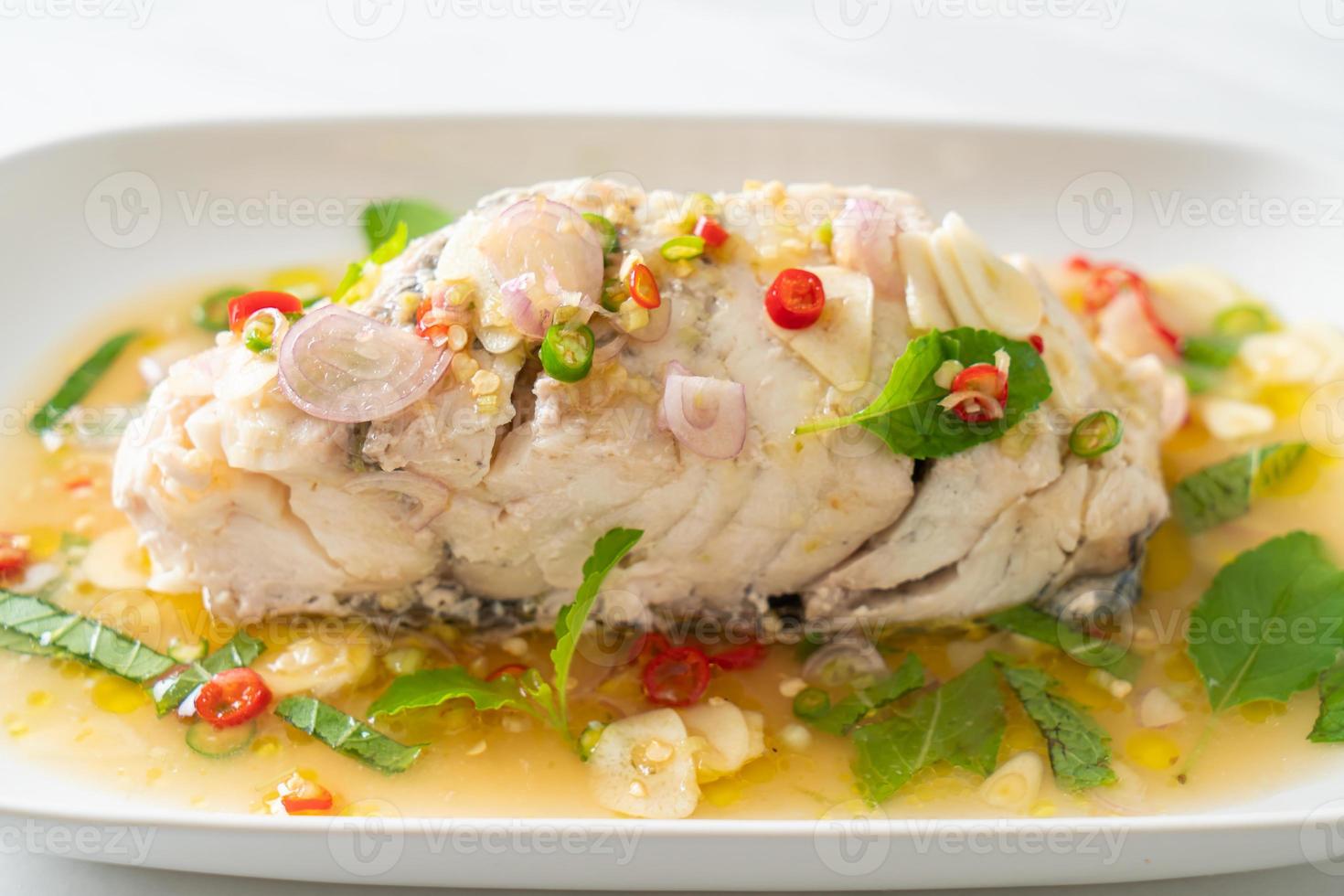 steamed sea bass fish with herbs 9724657 Stock Photo at Vecteezy